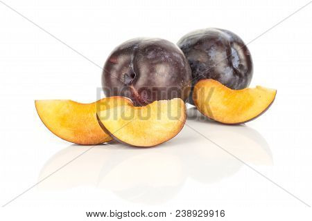 Two Red Blue Plums And Three Slices Isolated On White Background