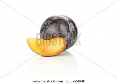 Red Blue Plum With One Slice Isolated On White Background