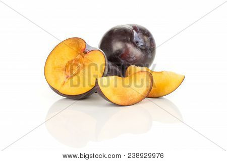 Red Blue Plums Set One Whole One Half And Two Slices Isolated On White Background