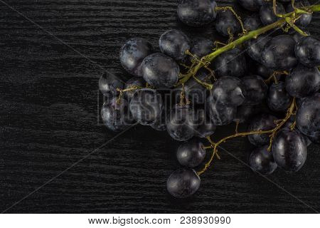 Black Grapes Cluster (autumn Royal Variety) Table Top Isolated On Black Wood Background