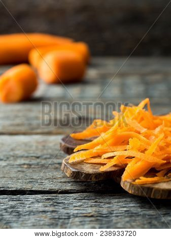 Grated Carrots On A Wooden Rustic Background Copy Space