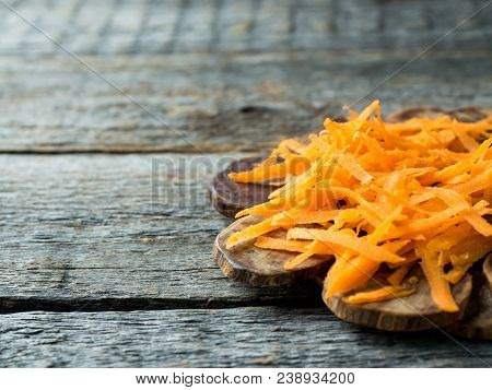 Grated Carrots On A Wooden Rustic Background Copy Space