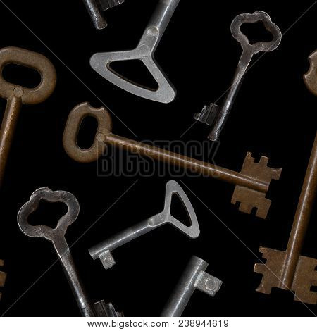 Seamless Pattern. Old Door Keys On A Black Background.
