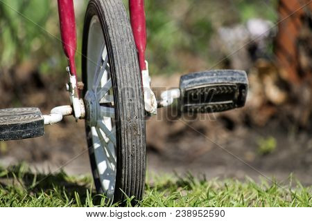 Front Wheel With Pedals. Part Of The Children's Three-wheeled Bicycle Of The Ussr 80S