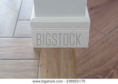 Laminate Parquete Flooring, Tiles Immitating Hardwood Flooring. Cork Compensator As An Adapter. Ligh