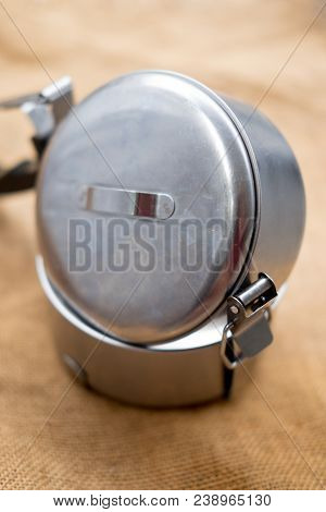 Silver Metal Tiffin Separate Food Container On Sacking Cloth Background