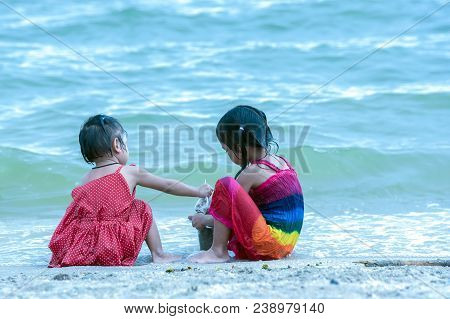 Aby Playing With Sand On Sea Shore