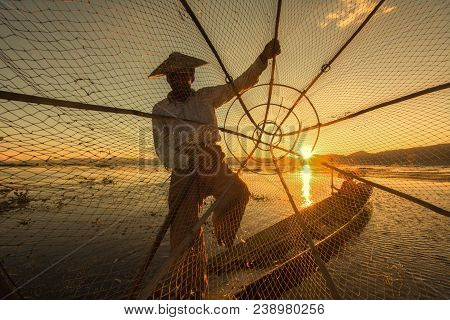 Silhouette Of Fisherman At Sunset Inle Lake Burma Myanmar