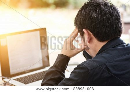 Disappointed Young Handsome Man Looking Tired And Covered His Face With His Hands While Sitting In H