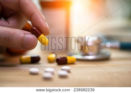Medicine Pills Or Capsules In Hand, Palm Or Fingers Of A Doctor Or Nurse. Drug Prescription For Trea
