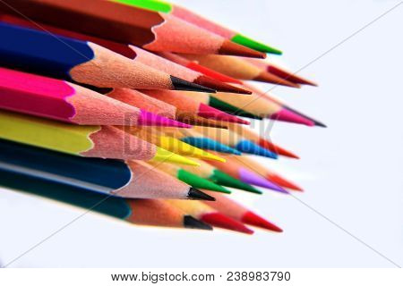 Color Pencils On A White Blurry Background