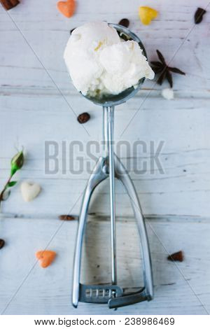 Ice Cream Scooper On White Wooden Background.