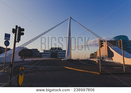 View Of Dublin's Famous Samuel Beckett Bridge Over The River Liffey At Blue Hour