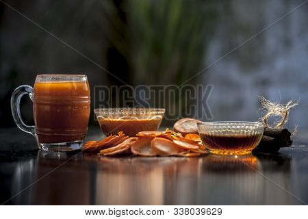 Freshly Sliced Carrots On The Wooden Surface Along With Its Juice And Face Mask Consisting Of Some H