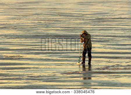Lipetsk, Russia - December 6, 2019: A Man Catches Fish On Ice In The Morning At The Matyr Reservoir.