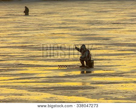 Lipetsk, Russia - December 6, 2019: A Man Catches Fish On Ice In The Morning At The Matyr Reservoir.