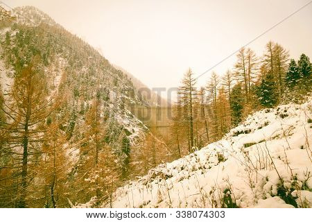 An Artificial Lake In The Italian Alps In A Winter Day