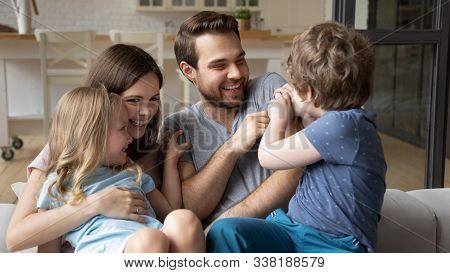 Children Spend Time With Parents Playing Tickling Dad Feels Overjoyed