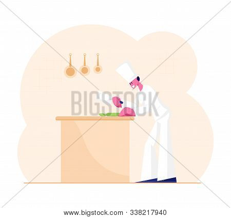 Concentrated Man Chef In White Uniform And Toque Slicing Vegetables On Table For Cooking Meal. Profe