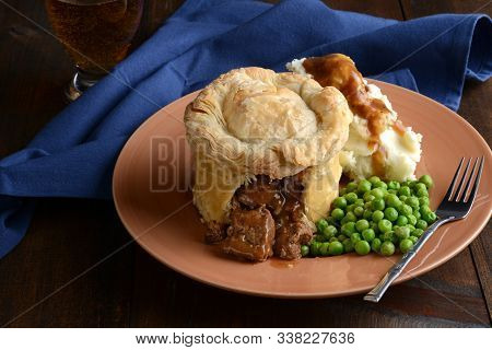 Steak Pub Pie With Gravy And Vegetables