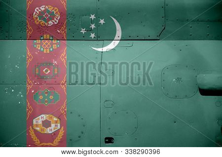 Turkmenistan Flag Depicted On Side Part Of Military Armored Helicopter Closeup. Army Forces Aircraft