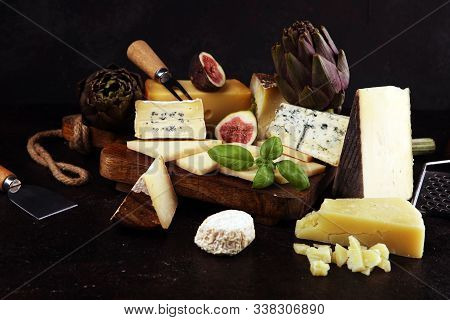 Different Sorts Of Cheese. Cheese Platter With Different Cheese And Spice