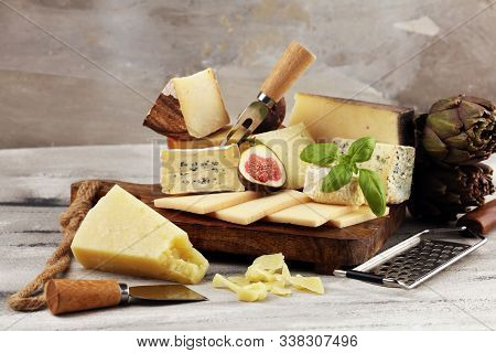 Different Sorts Of Cheese. Cheese Platter With Different Cheese And Spice