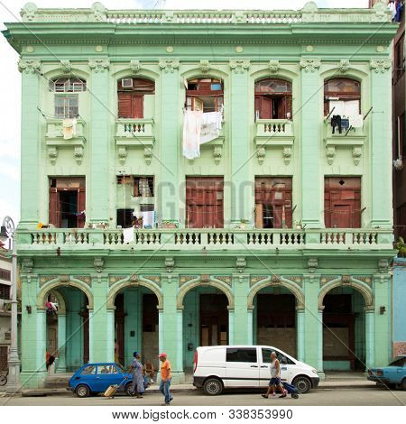 HAVANA-CUBA- DEC 5, 2018: Green colonial traditional house on the street in Centro Habana, one of the 15 municipalities or boroughs in the city of Havana, Cuba.
