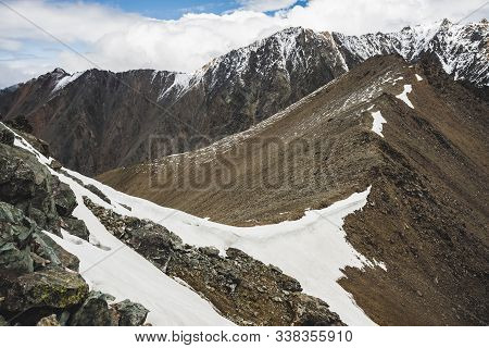 Atmospheric Minimalist Alpine Landscape With Massive Snowy Mountain Range And Firn On Combe Rocky Hi