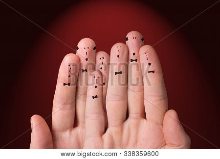 Faces Are Painted On The Fingers. Choir Singing Together. Cheerful Fingers Depict A Classic Choir