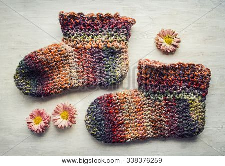 Crochet Cozy Comfortable Slippers. Photo Home Shoes On A Light Background ..