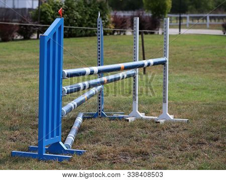 Image Of Show Jumping Poles On Empty Training Field. Wooden Barriers For Jumping Horses As A Backgro