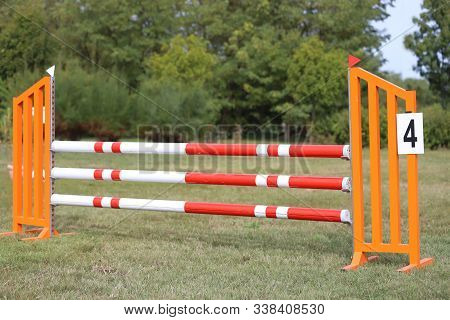 Image Of Show Jumping Poles On Empty Training Field. Wooden Barriers For Jumping Horses As A Backgro