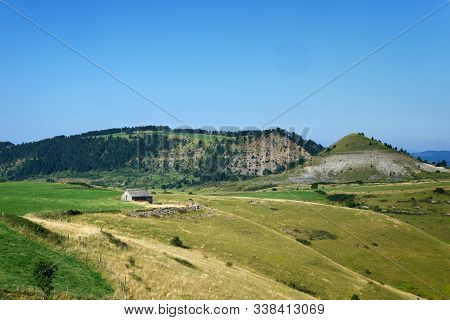 View Of A Little Barn On A Mountanious Landscape In Occitanie, France