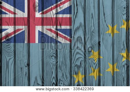 Tuvalu Flag Depicted In Bright Paint Colors On Old Wooden Wall. Textured Banner On Rough Background