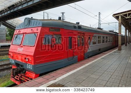 Bologoye, Russia - August 8, 2019: The Train Is Waiting For Passengers Near The Building Of The Rail