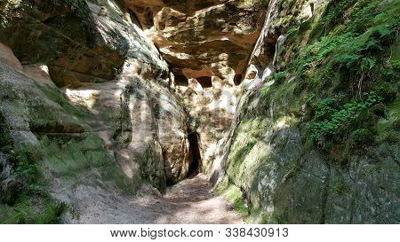 Licu Langu Sandstone Cliffs. The Big Langu Cave. Sand Formations At Lode Behind Cesis In Latvia.