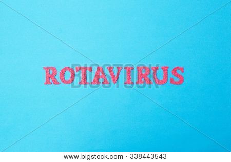 Word Rotavirus Made Of Red Letters On A Blue Background. The Concept Of Rotavirus Infection In Child