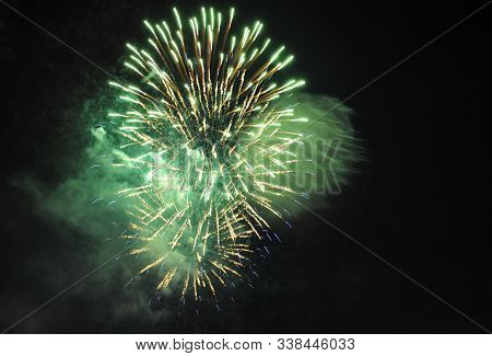 Colorful Salute, Great Explodes In Different Colors In The Night Sky, Beautifully Dissolving In The 