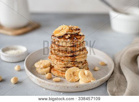Tasty Oatmeal Pancake With Banana, Nuts And Date Syrup. Gray Background, Horizontal Image