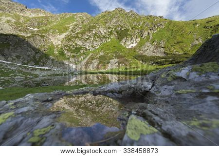Alpine Lake Under Pietrosul Mountain In Romania
