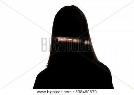 Dramatic Portrait Of Caucasian Young Girl In The Dark Isolated On White Studio Background. Sunlight 