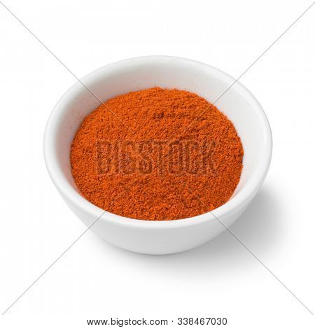 Bowl with ground Annatto powder isolated on white background