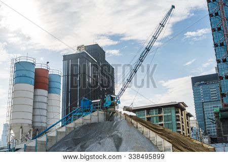 Blue Crane On A Modern Construction Site. Construction Crane On A Constructin Site. Crane Machine St