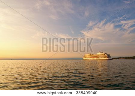 Scenic View Of Beautiful Large White Ship. Panoramic Dramatic Sunset Sky. Ship Glides Out Of The Por