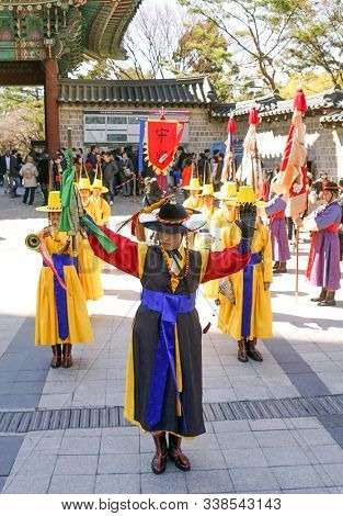 Seoul, March - 2019: Guard change ceremony at the Deoksugung Royal Palace. Procession with musicians.