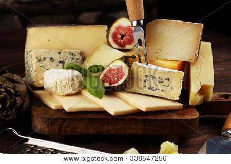 Different Sorts Of Cheese. Cheese Platter With Different Cheese And Spice
