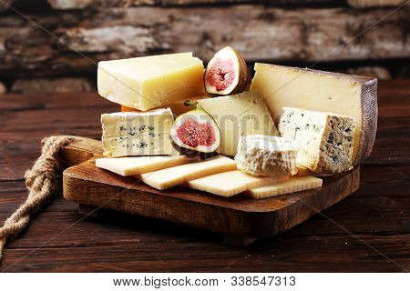 Different Sorts Of Cheese. Cheese Platter With Different Cheese And Spice