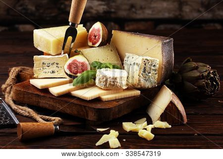 Different Sorts Of Cheese. Cheese Platter With Different Cheese And Spice