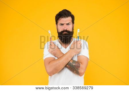 No Toothache. Bearded Man Hold Toothbrushes. Hipster With Tooth Brushes. Teeth Care. Oral Hygiene. D